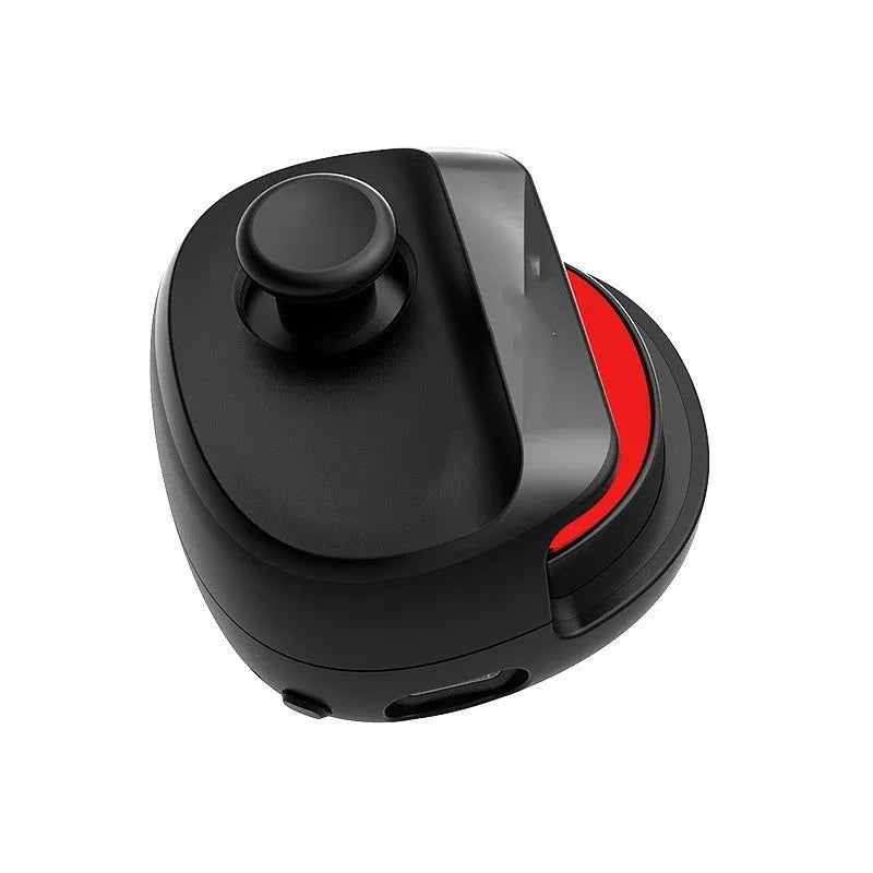 Compact black and white USB gaming stick controller on a flat surface, showing its size and ergonomic design.