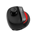 Compact black and white USB gaming stick controller on a flat surface, showing its size and ergonomic design.