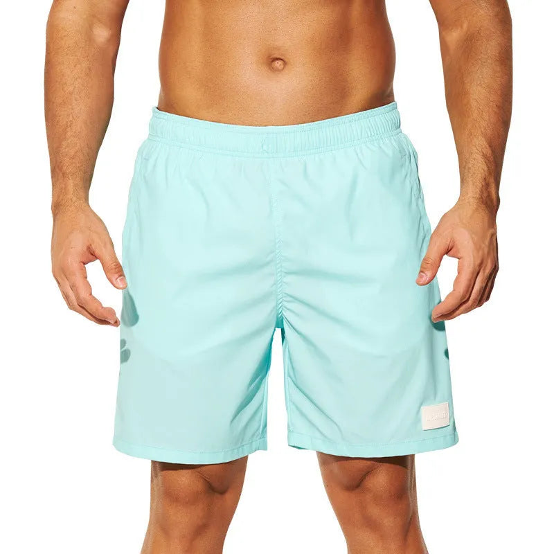 Men's nylon sports shorts in solid colours with straight leg opening and elastic waistband