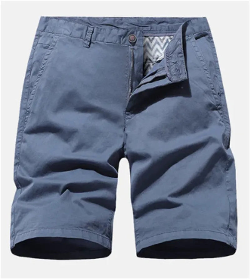 Men's loose-fit straight-leg denim shorts in a printed blue colour, shown laid flat.