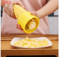 Yellow manual corn grinder thresher with corn-shaped plastic body and stainless steel peeling gear