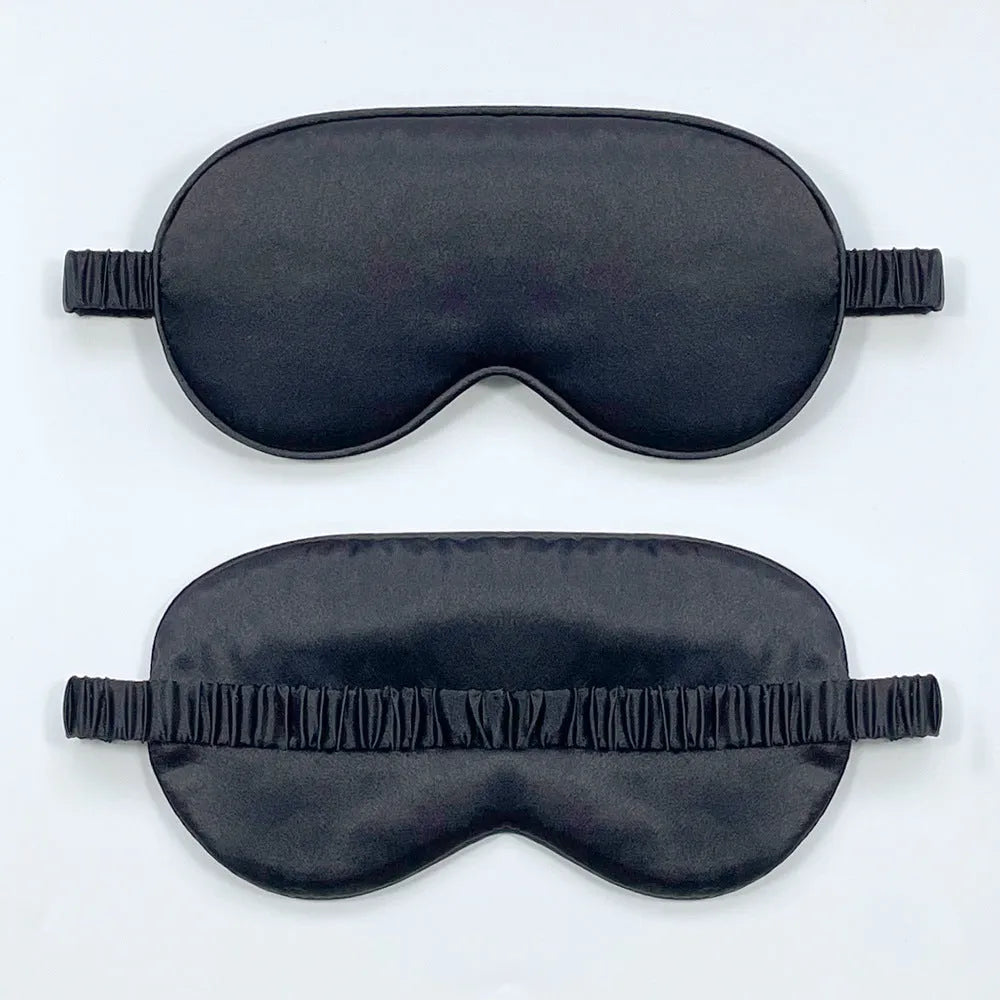 Rayon satin double-sided sleep mask in a selection of solid colours on a white background.