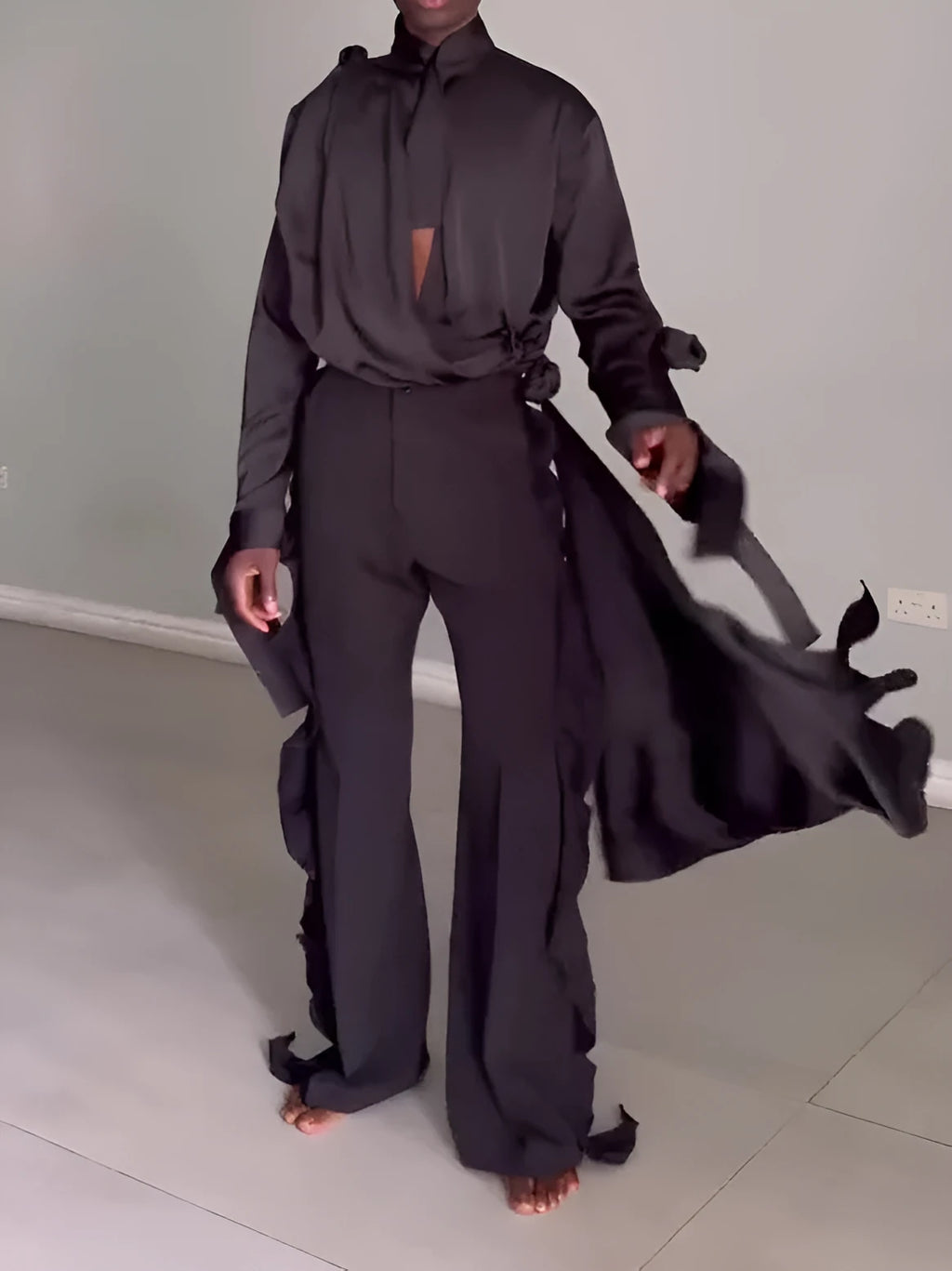 Men's black hollow cut out shirt and high waist pants suit set on display, polyester fabric, regular fit
