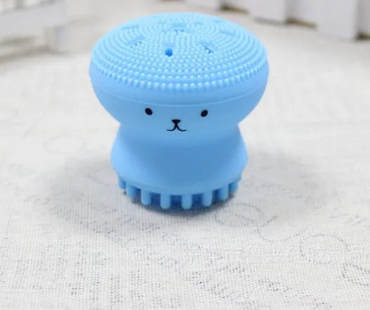 Cartoon octopus silicone wash brush in pink for manual facial cleansing and massage