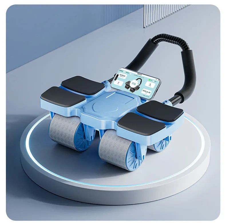 Black automatic rebound abdominal wheel with four wheels and rubber grips on a wooden floor.