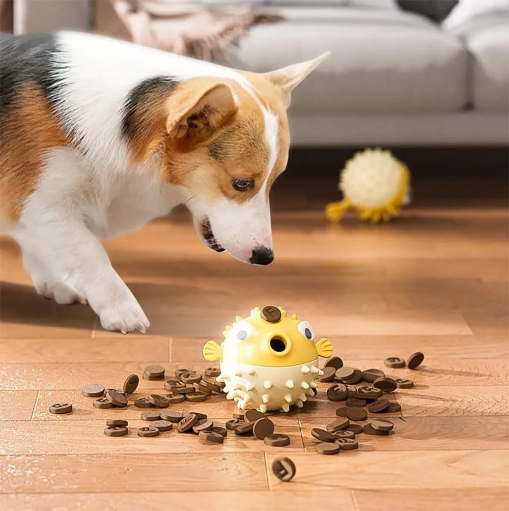 Green fish-shaped interactive dog chew toy with textured surface for treat dispensing and teeth cleaning.