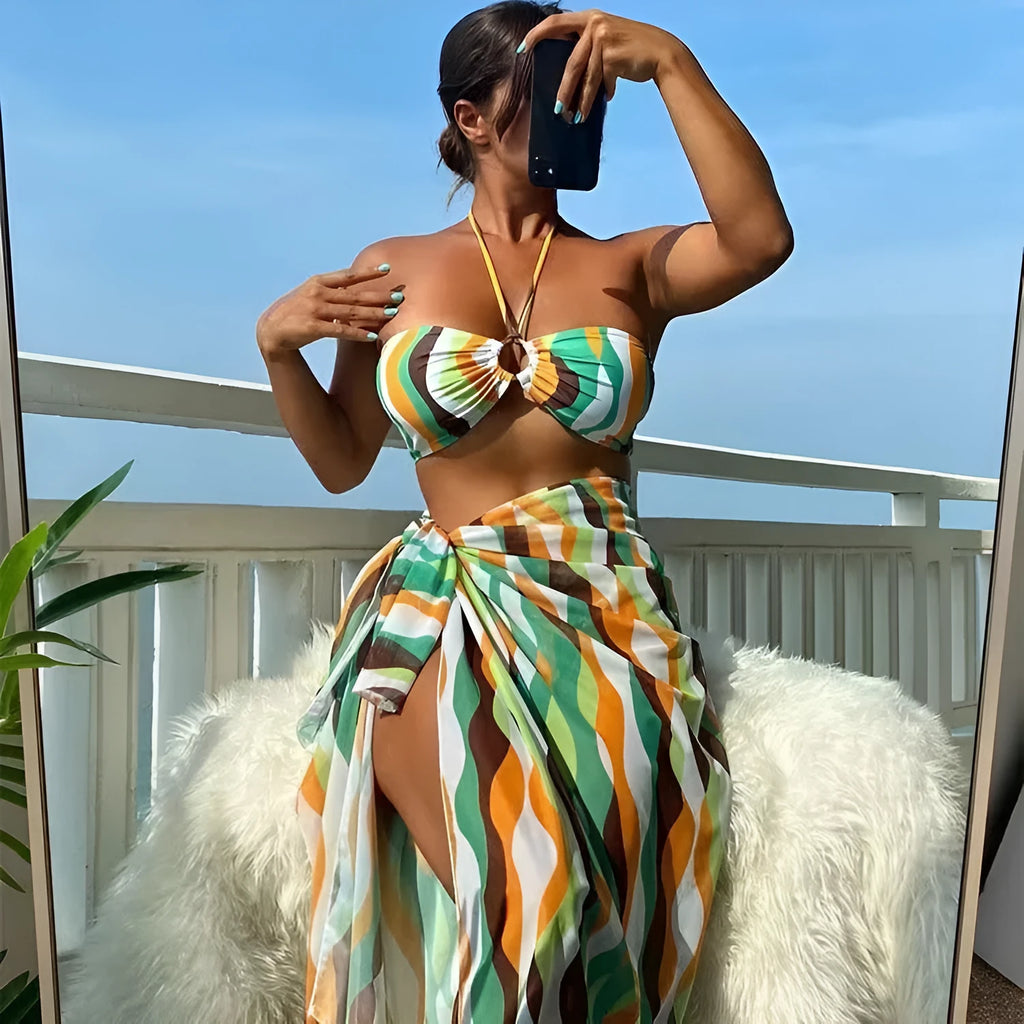 Women's three-piece split swimsuit set with top, briefs, and printed beach skirt in yellow green, magenta, or purple