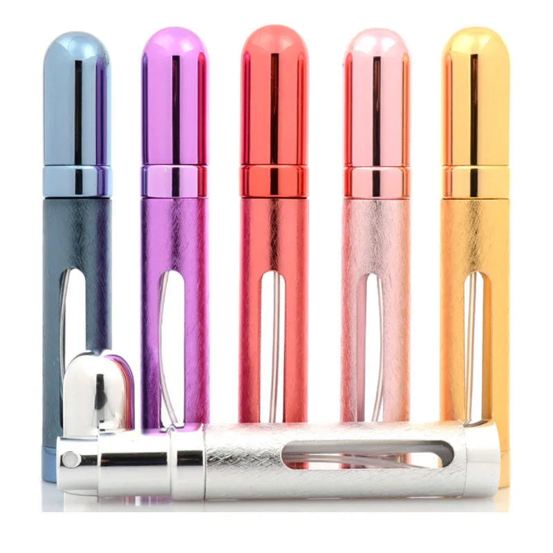 Refillable aluminium travel perfume atomiser with glass liner in blue, gold, pink, red, silver, or violet.