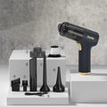 Black wireless handheld vacuum cleaner with multiple nozzle attachments for car and home use.