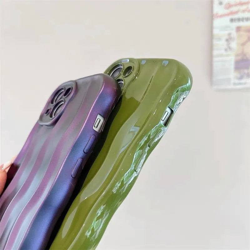 Silicone iPhone 17 phone case with water ripple texture in green, shown fitted to a phone.