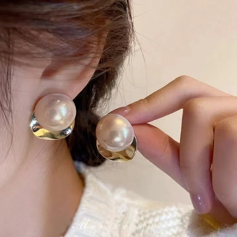 Fashionable alloy round drop earrings in gold tone, 1.2 cm diameter, on a white background