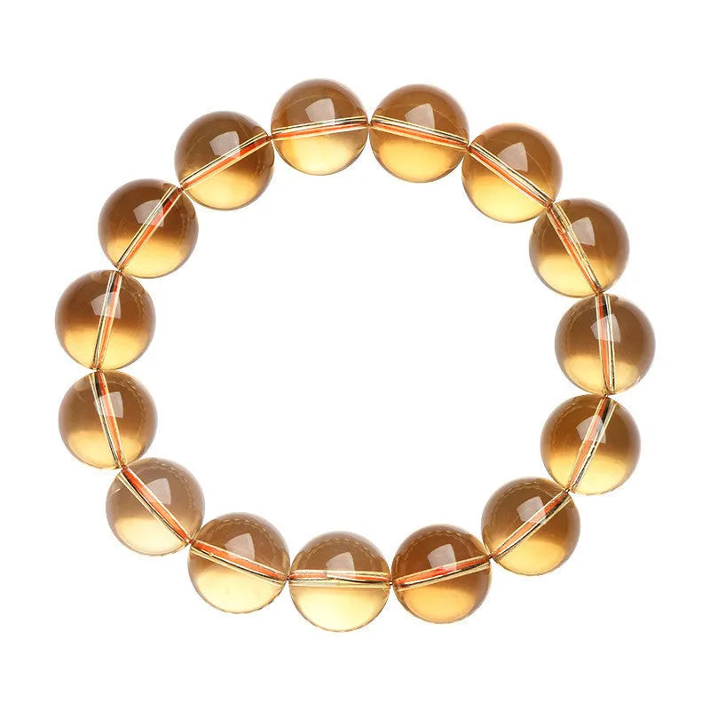 Natural golden citrine bead bracelet with scattered design on a wrist, showing adjustable clasp and polished stone detail.