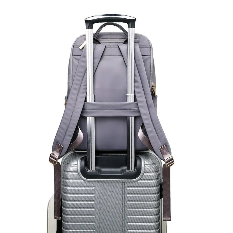 Women's large Oxford cloth backpack in black, showing front compartment and breathable back panel