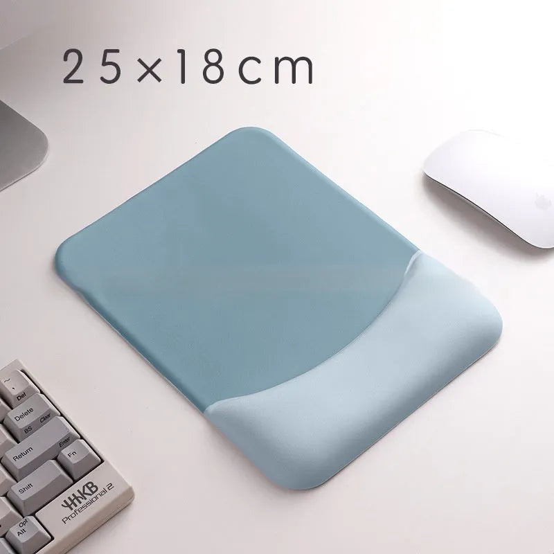 Square black silica gel mouse pad with raised keyboard support area and integrated wrist rest on a wooden desk.