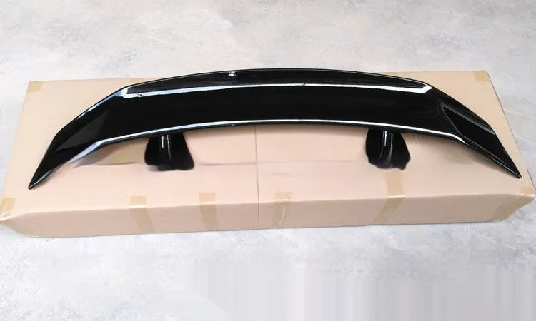 Universal punch-free car spoiler tail wing in ABS plastic, shown in bright black finish.