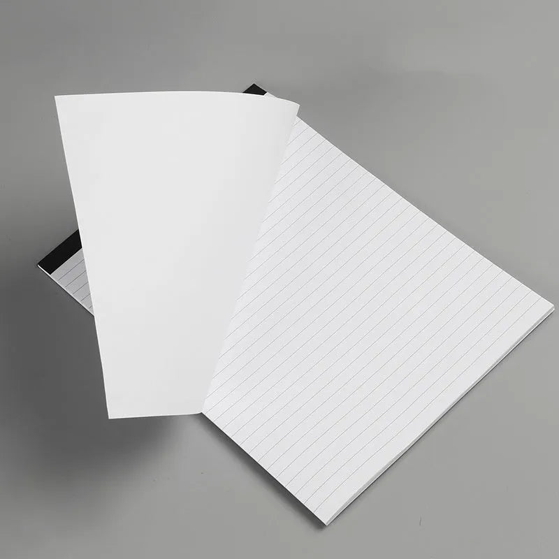 A4 tearable notebook with soft cover open to show gridded ivory white paper inside.