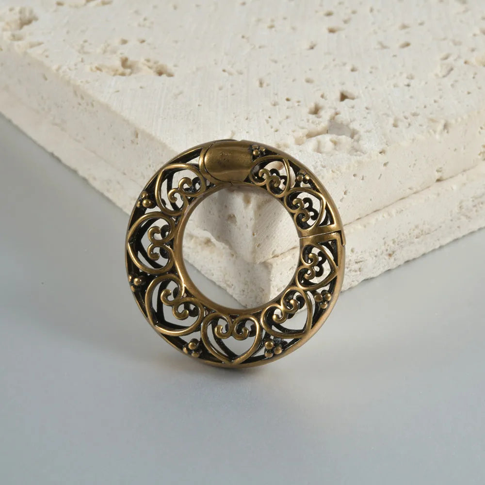 Retro heart-shaped and lotus magnetic earrings in stainless steel with antique finishes