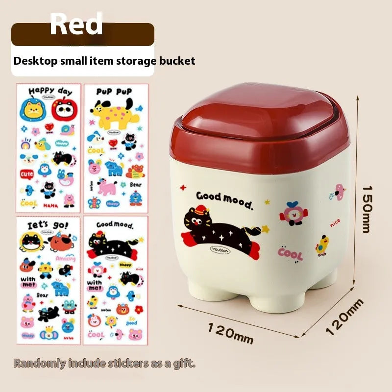 Cartoon-style plastic desktop organiser with grid compartments and red or brown stickers.