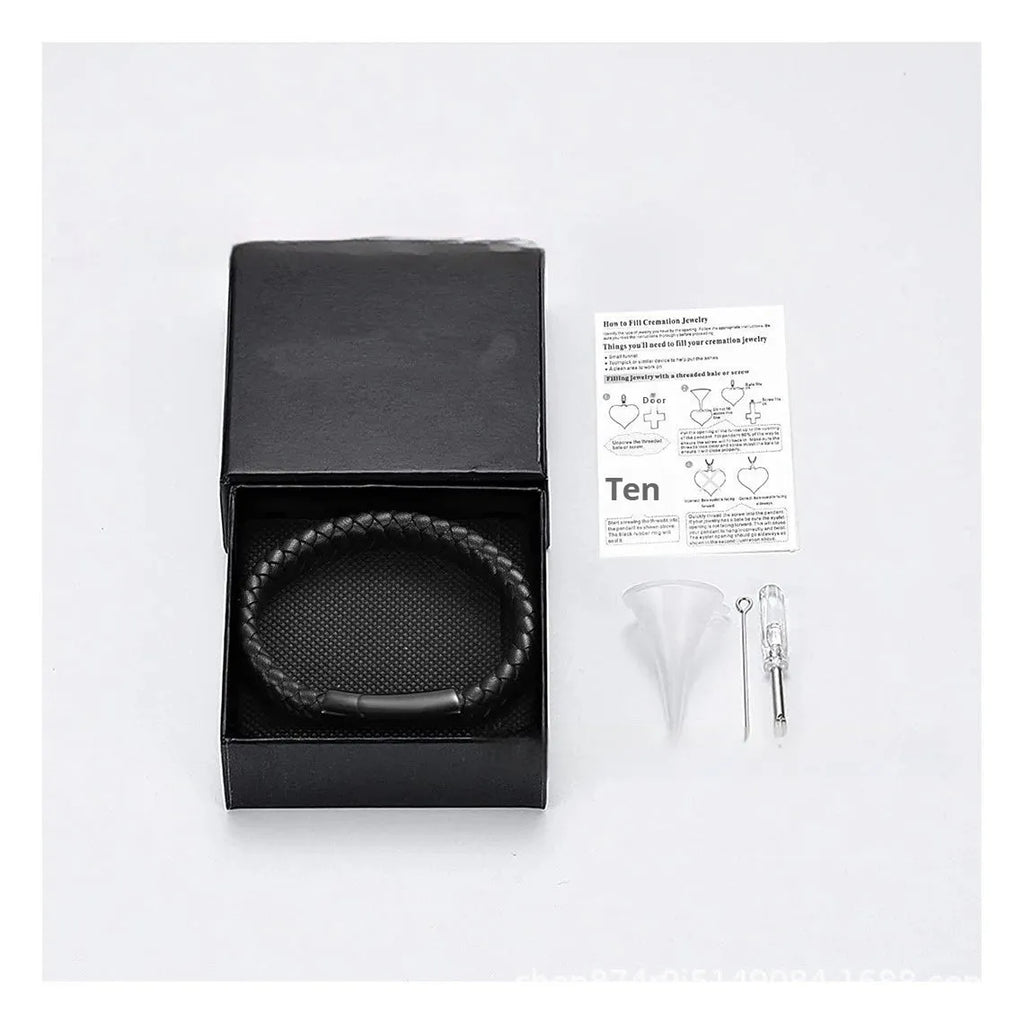 Men's black woven leather bracelet with a stainless steel casket capsule for remembrance.