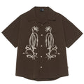 Brown striped men's short sleeve outdoor shirt with Cuban collar on a hanger