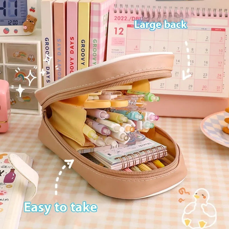 Transparent PVC pencil case with large capacity, featuring a cute Korean-style cartoon bear design.