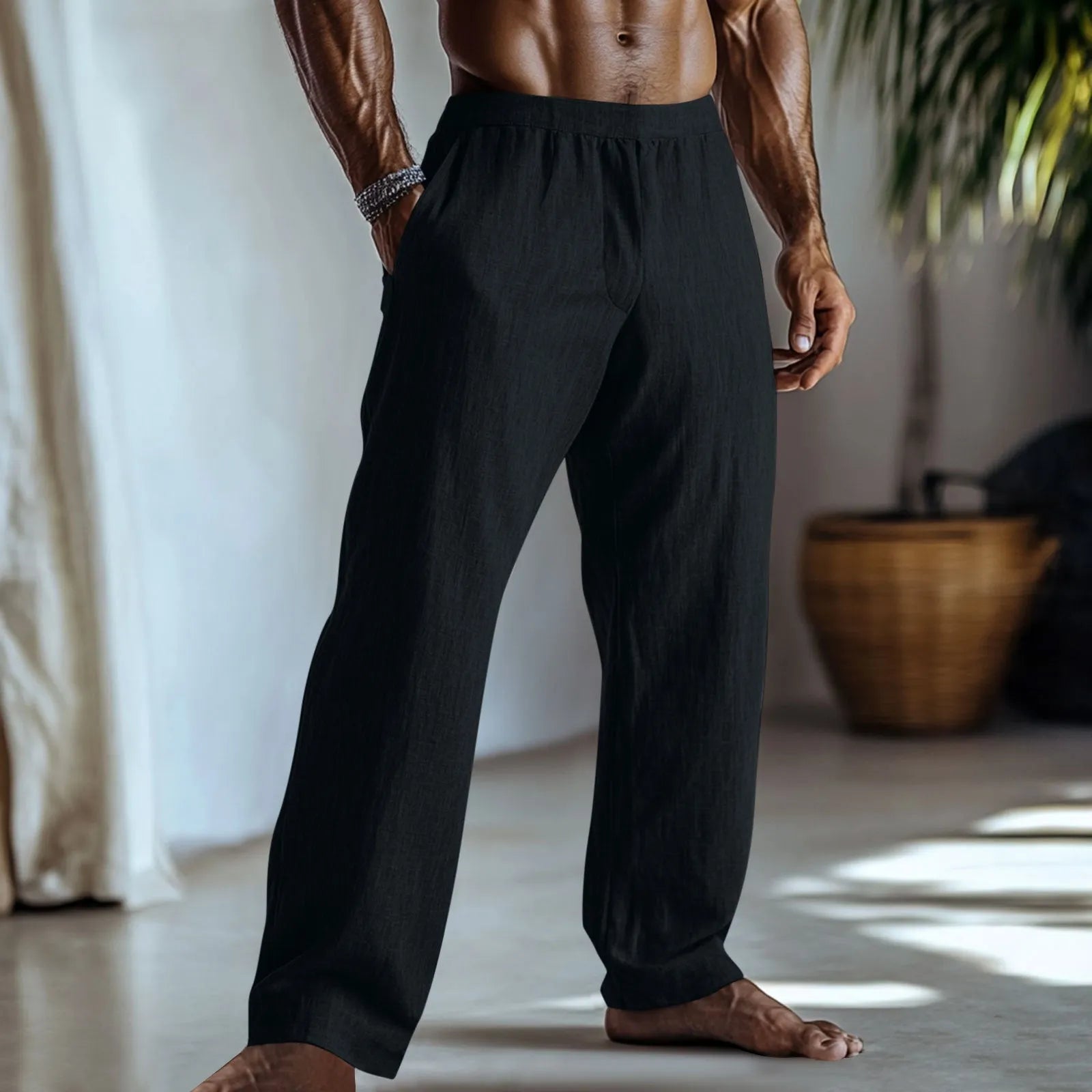 Straight leg cotton linen trousers in light apricot colour on a hanger.