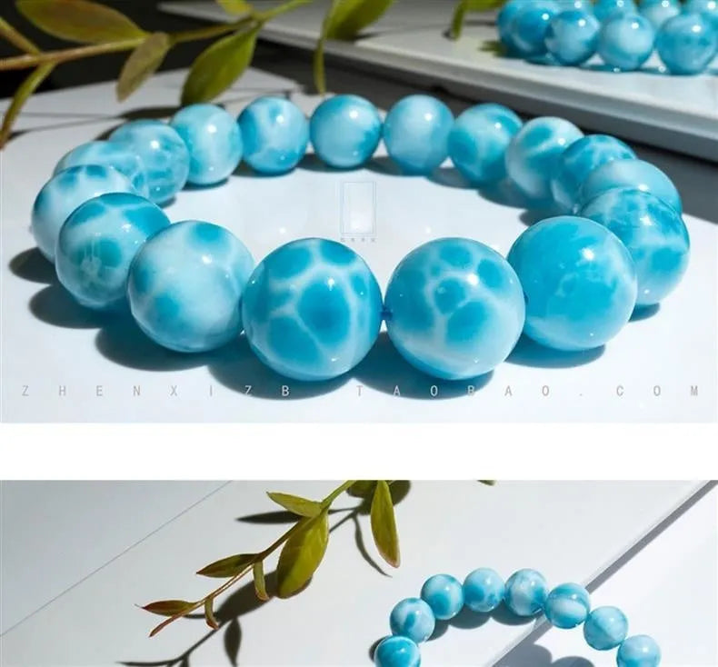 Blue hand-crafted bodhi bracelet with a pearl accent, showing bead sizing options.