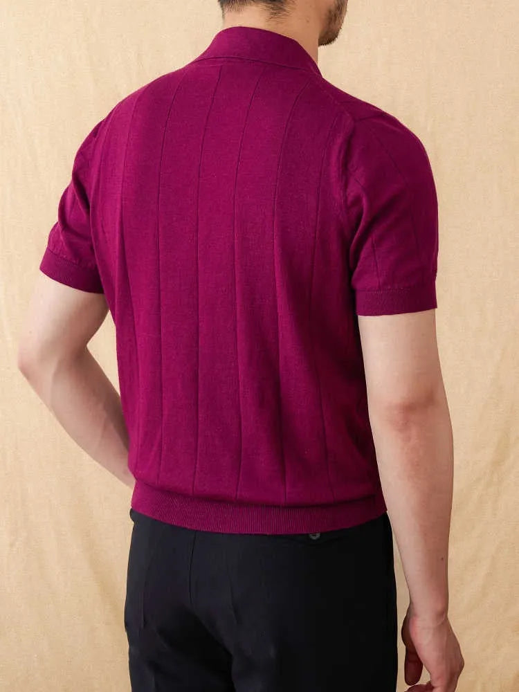 Men's purple short sleeve polo top with a knitted sunken stripe pattern and a classic collar.