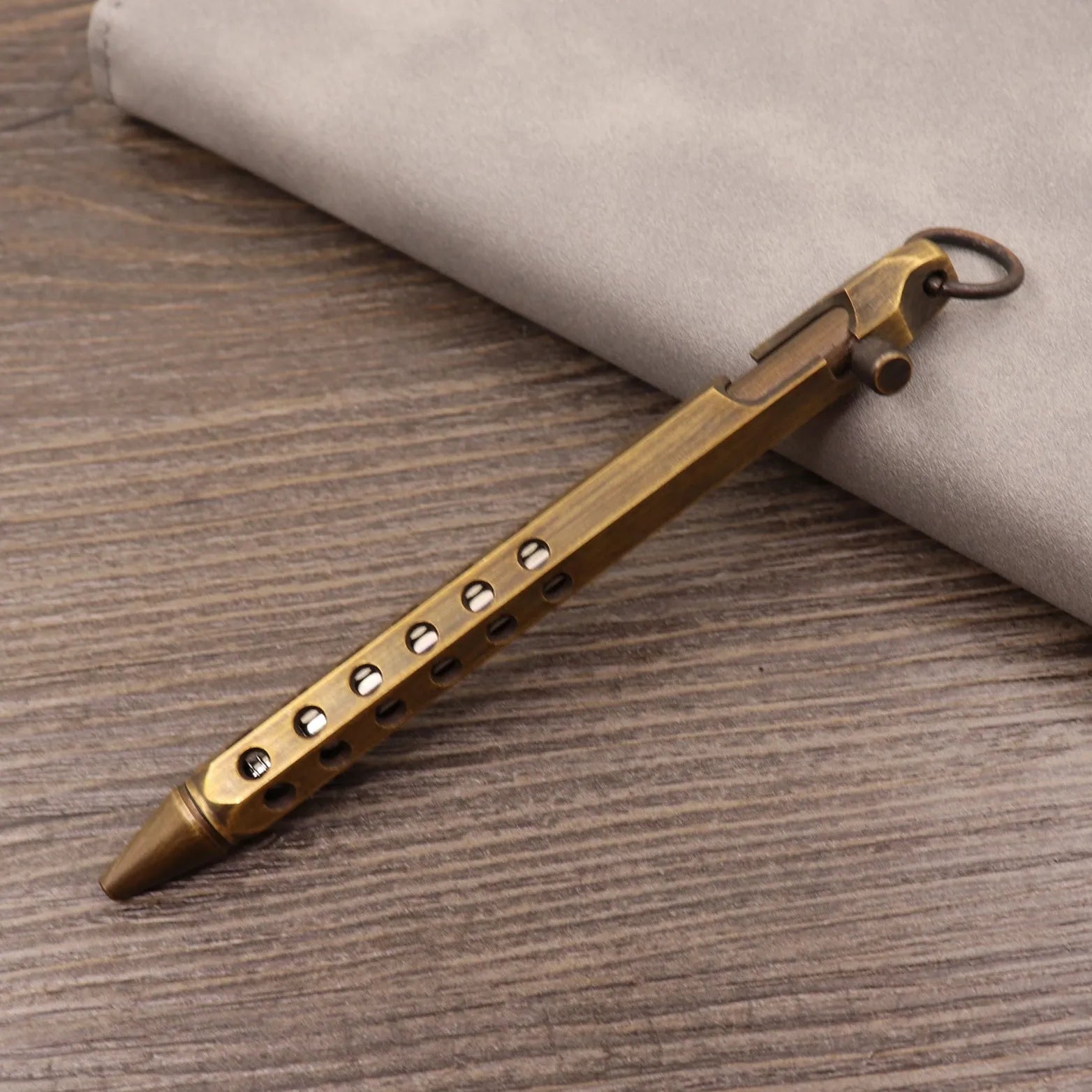 Brass tactical pen with retro colour finish and press mechanism