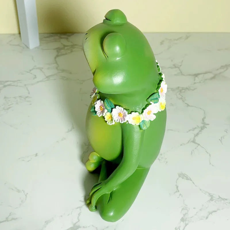 A green European style yoga frog ornament made from plastic and resin for home decoration.