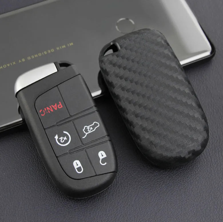 Carbon fibre pattern silicone protective case covering a Dodge, Chrysler, and Fiat car key fob