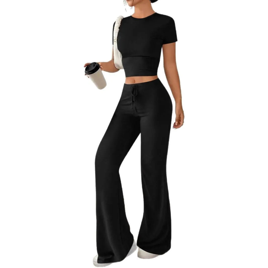 Black high-waisted trousers and short sleeve T-shirt co-ordinated suit for women.