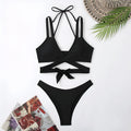 A solid colour women's bikini with straps, shown in a brief style, available in multiple colours.