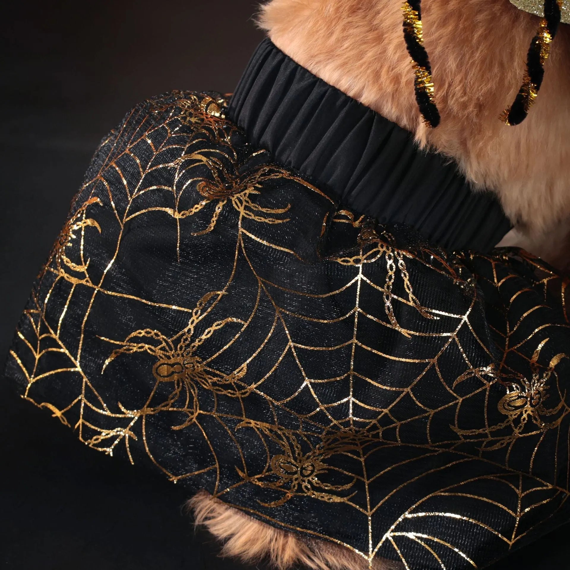 A dog wearing a classic suit-style Halloween costume, available in sizes small to extra large.