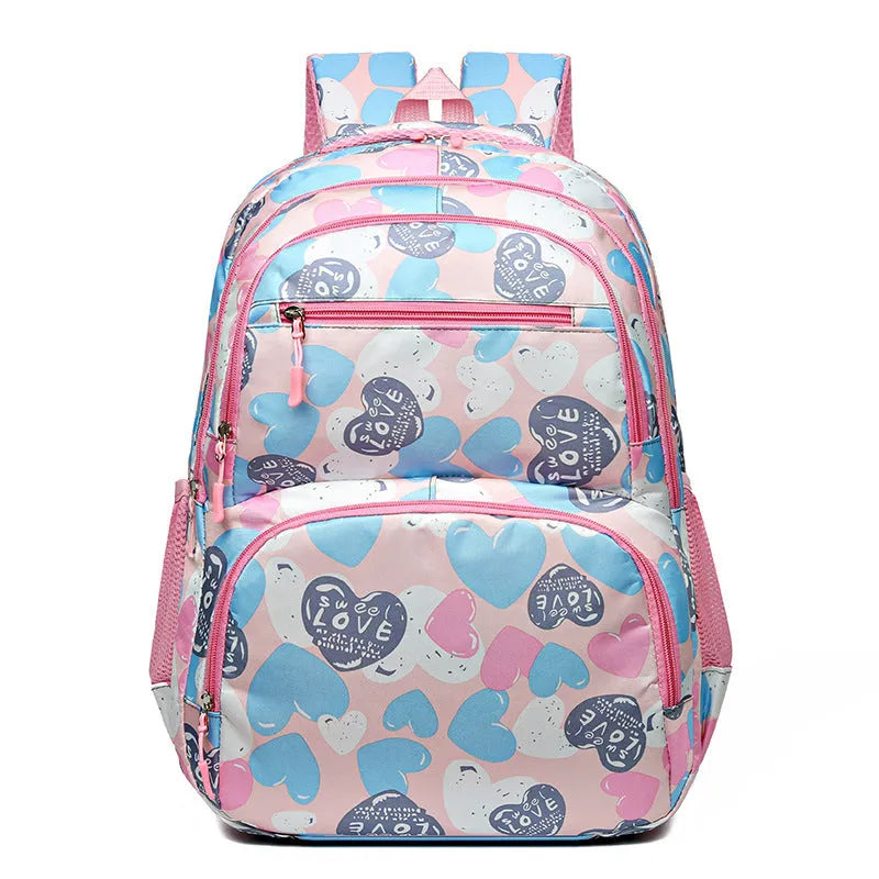 Blue children's school backpack with air pillow straps on a grey background.