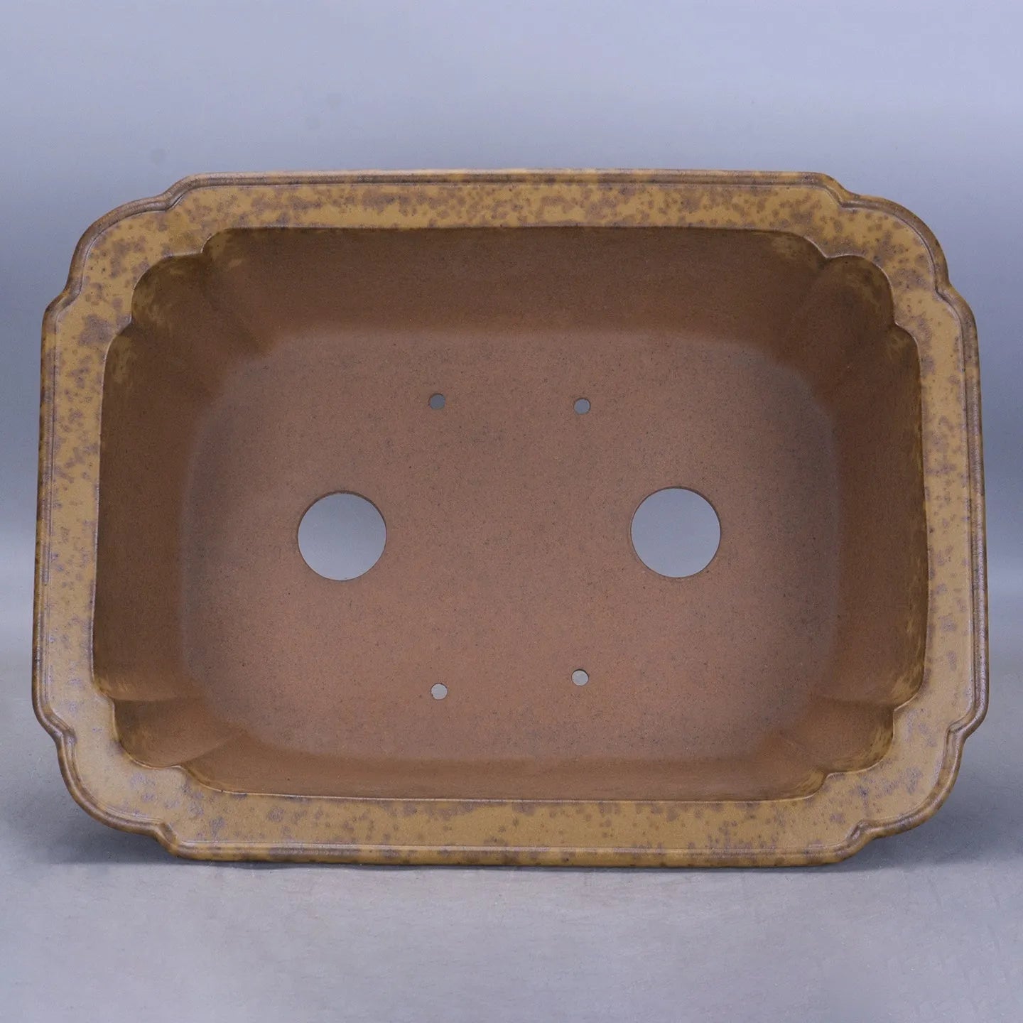 Large rectangular purple sand clay floor planter with modern minimalist design on a wooden floor.