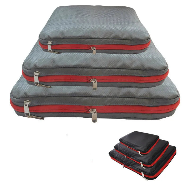 Green travel compression storage bag made of waterproof nylon in cube shape on a white background