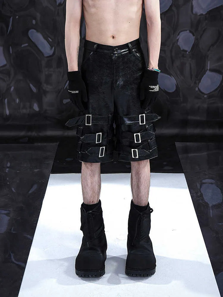 Black men's PU leather casual cropped shorts with a medium low waist on a mannequin.