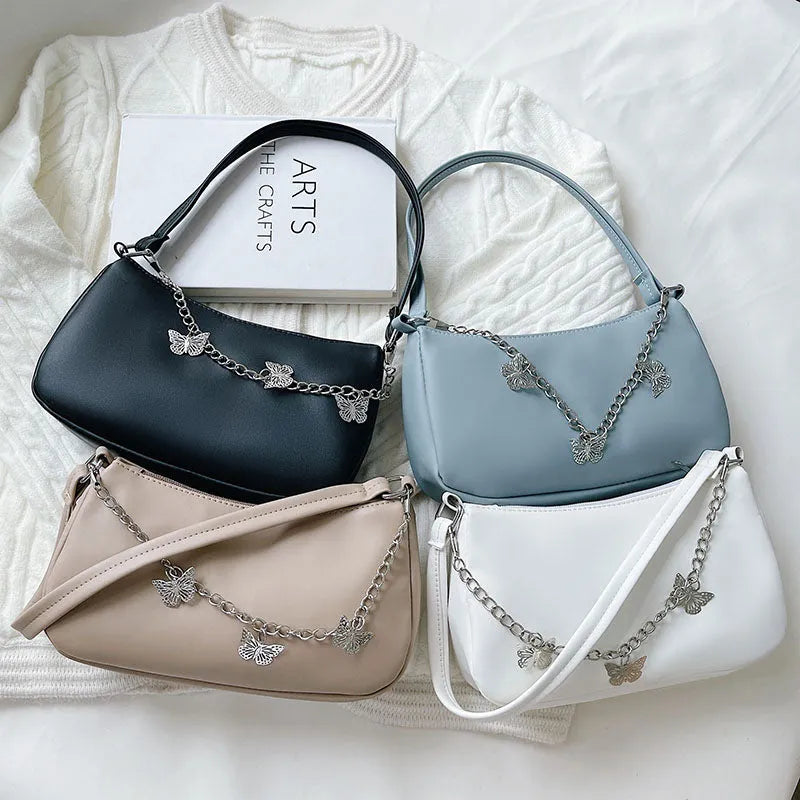 Butterfly chain shoulder crossbody bag in horizontal square shape with separate internal compartments