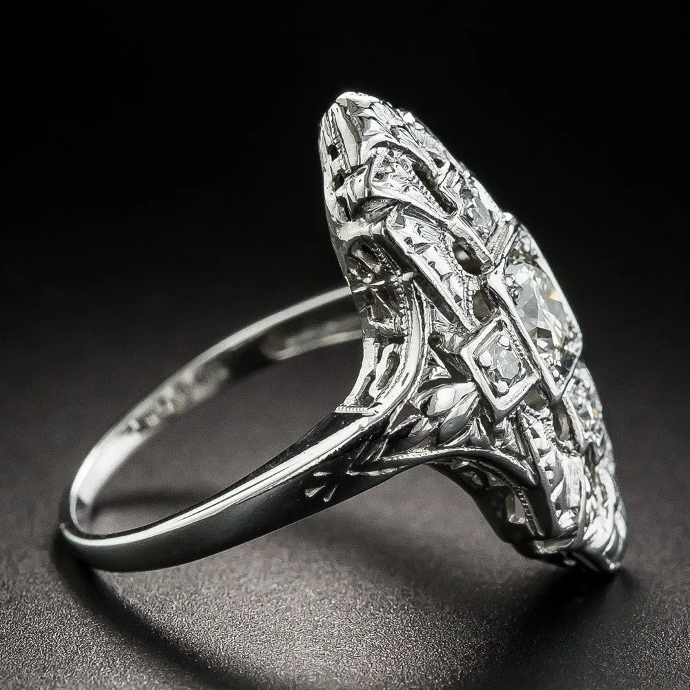 Hollow geometric silver-coloured ring with diamond studs on copper base