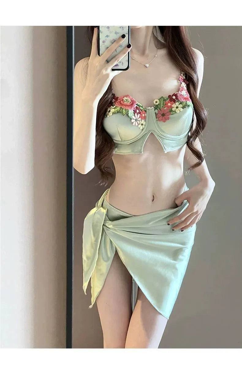 Green women's triangle bikini three-piece set with skirt on Asian size mannequin