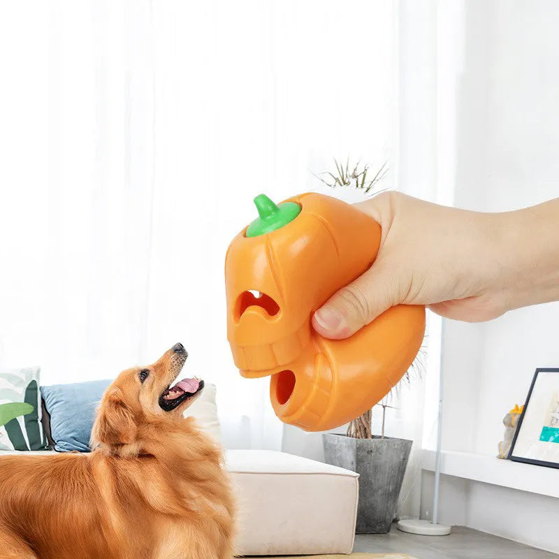 Halloween pumpkin shaped interactive dog chew toy with treat dispensing funnel
