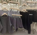 Women's loose grey acrylic knit sweater and wide-leg shorts set laid flat.