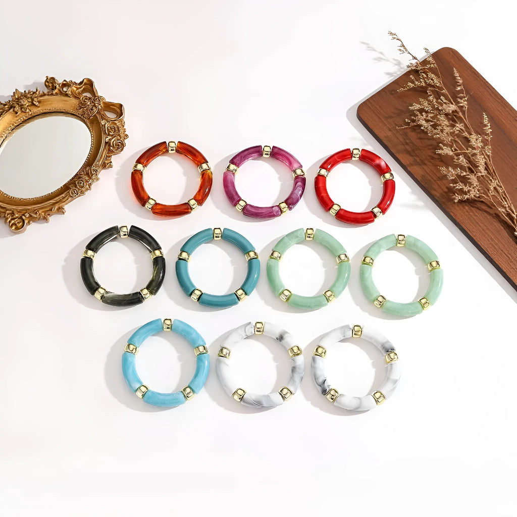 Acrylic bent tube bracelet in selected colour, lightweight and adjustable design.