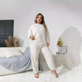 Creamy white women's two-piece polyester pyjama set with long sleeves and trousers