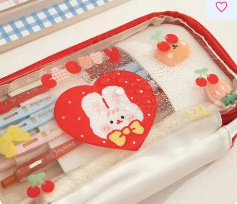 Transparent heart-shaped TPU pen case with Korean-style multicolour decoration in pink cake rabbit design.