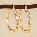 Geometric copper ear clips with ring and line design in golden colour for women