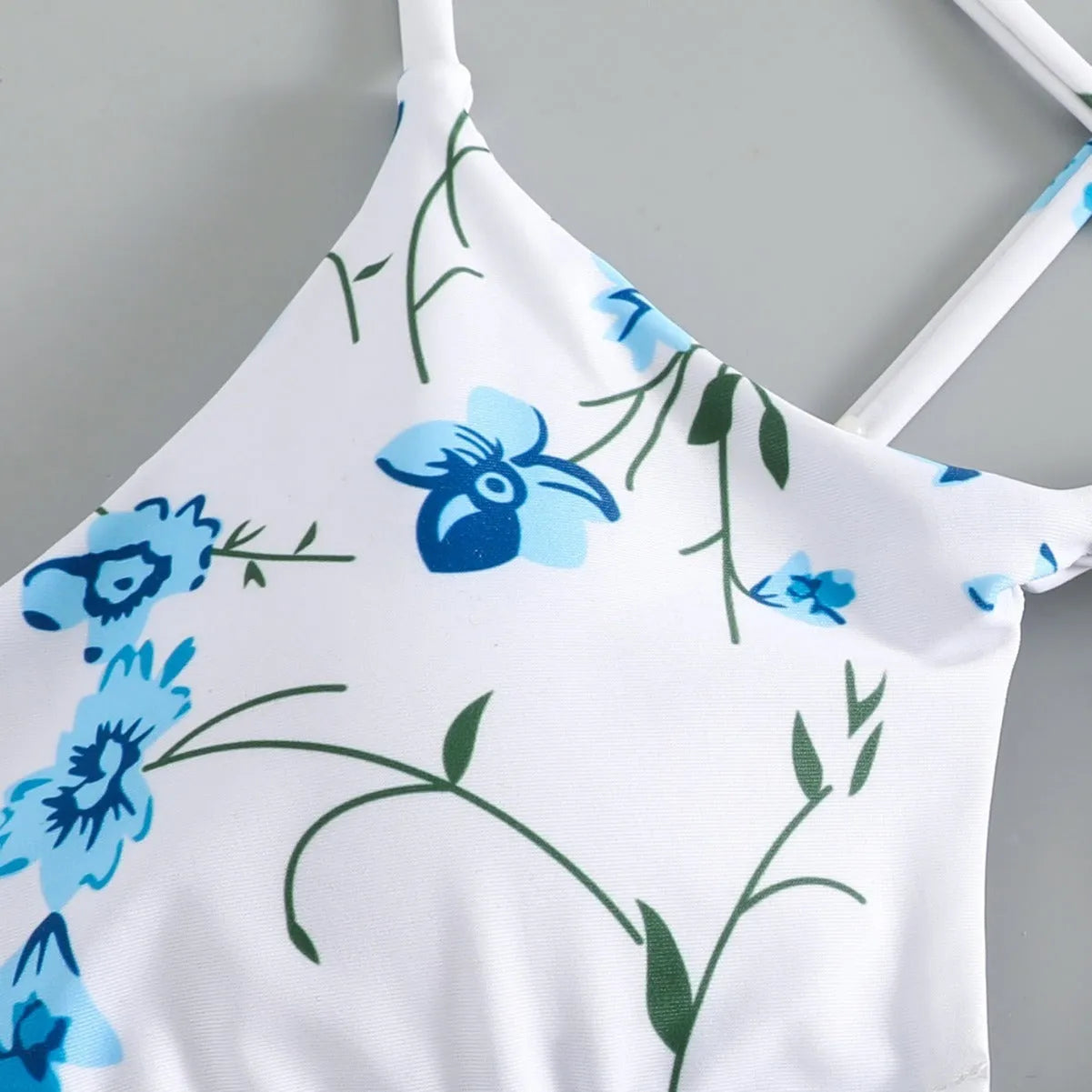 Women's floral pattern swimsuit with tie-neck triangle top and matching shorts