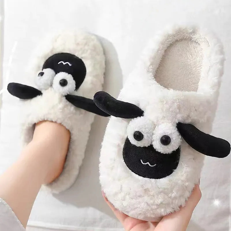 Brown lamb thermal cotton slip-on slippers with a stitched PVC sole on a wooden floor.