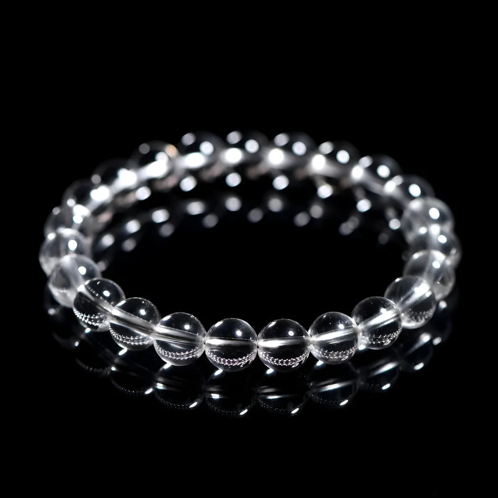 Natural old mine white crystal round bead bracelet with geometric style on a wrist.
